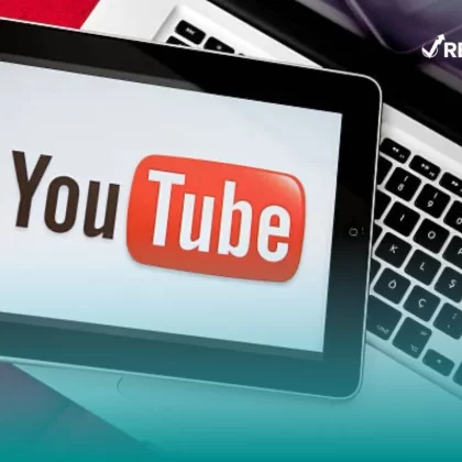 Computadora con el logo de la plataforma donde los youtubers financieros suben su contenido.